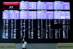 Shares of Japanese Car and Chipmakers Surge as Yen Dips