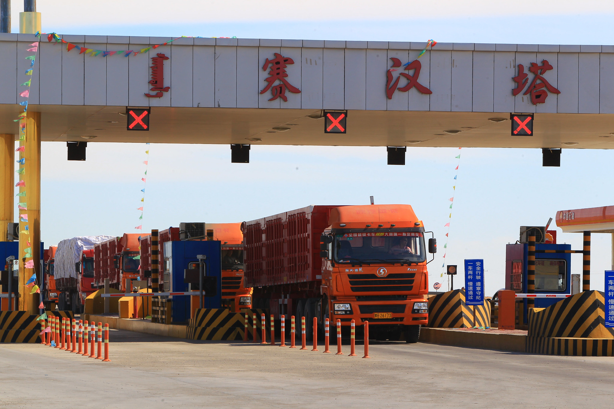 Trucks at a China toll