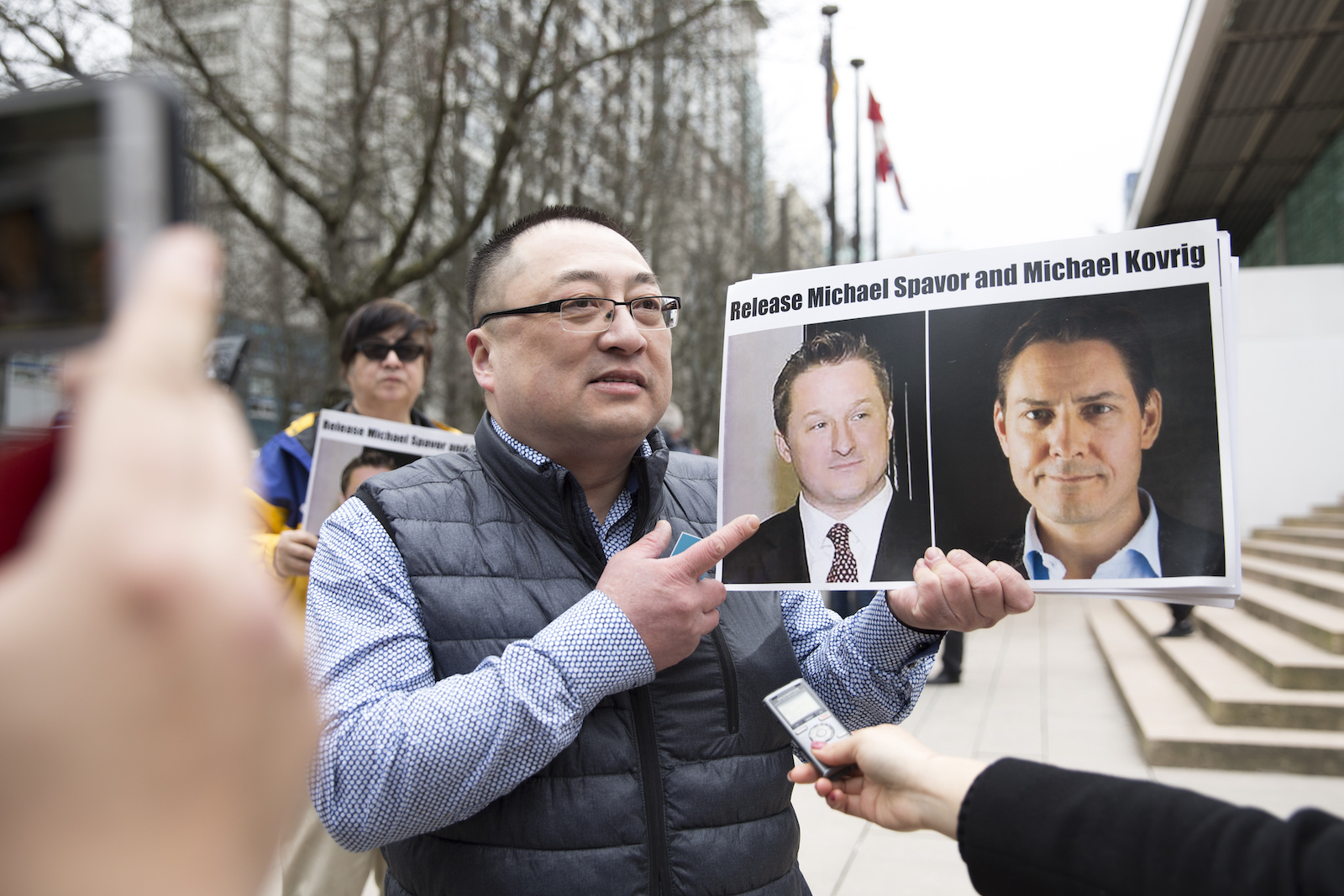 China suspends visits to detained Canadian pair