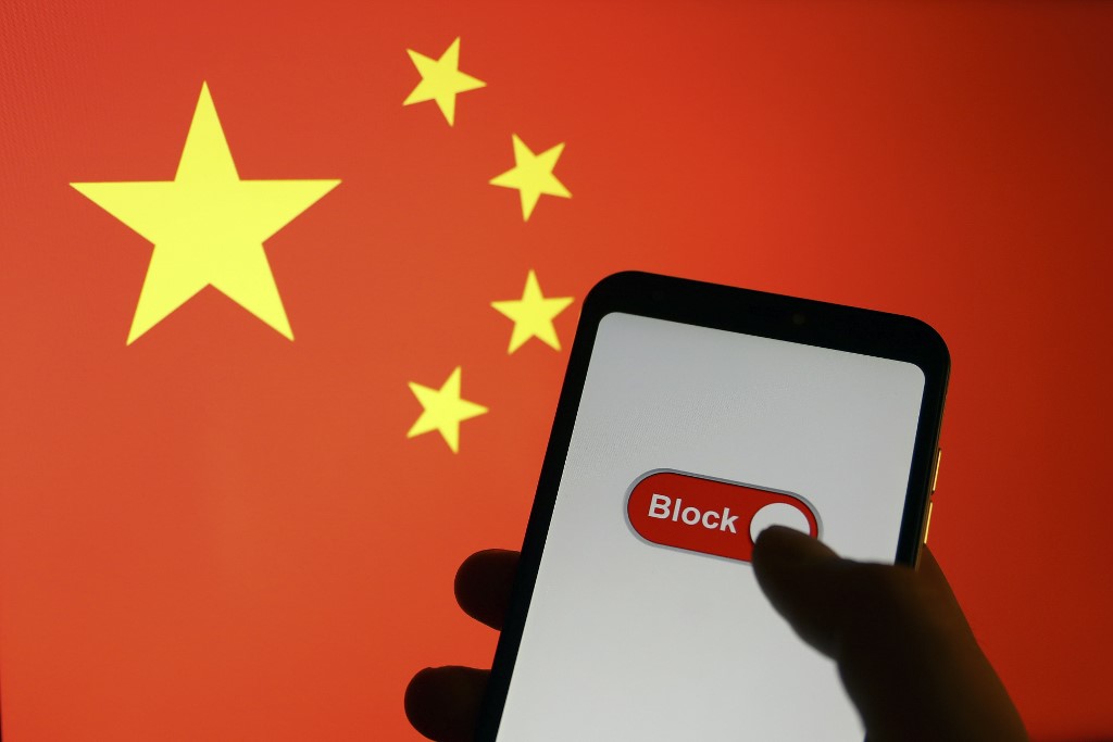 An illustration depicting China's flag and blocked app