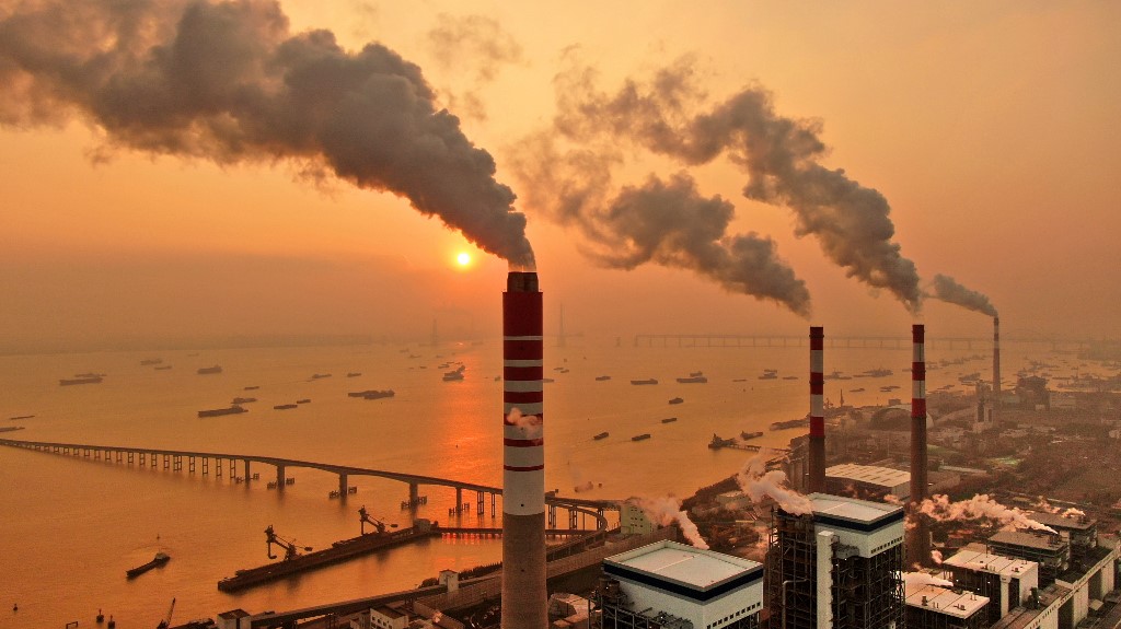 Smoke spews from China power plants in a year in which green China stocks outperformed