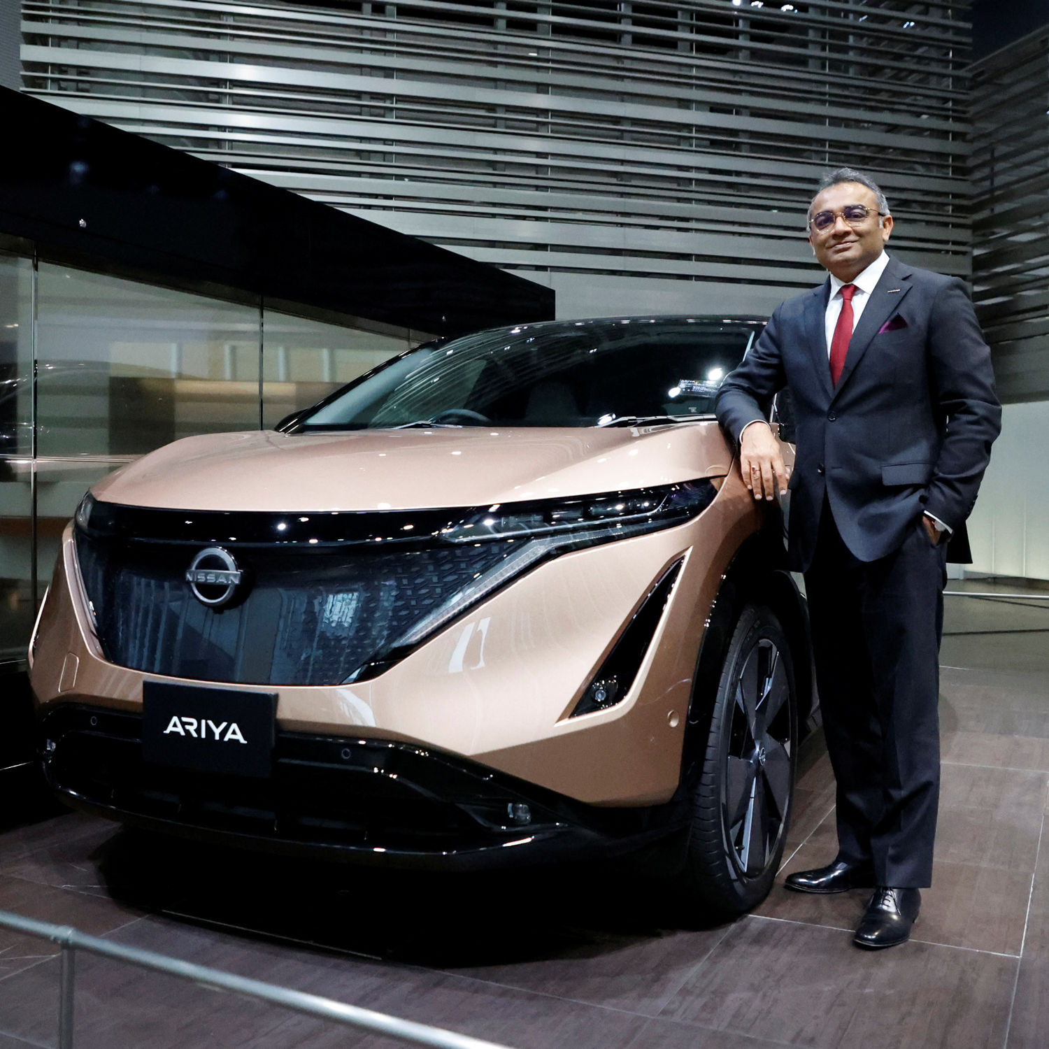 Nissan chief operating officer Ashwani Gupta poses with the Ariya all-electric SUV in Yokohama. Photo: Reuters.
