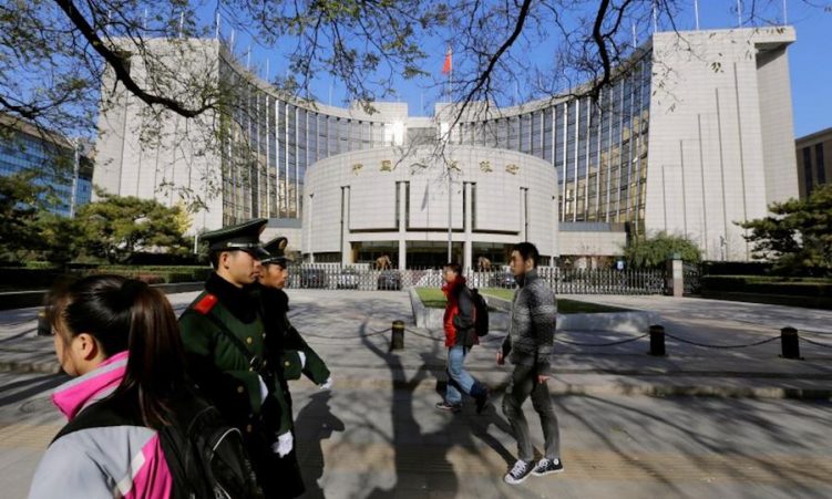 Staff at China's central bank and the country's securities regulator have suffered a pay cut this year.