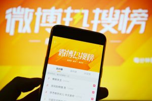 Sina joins exodus from US markets