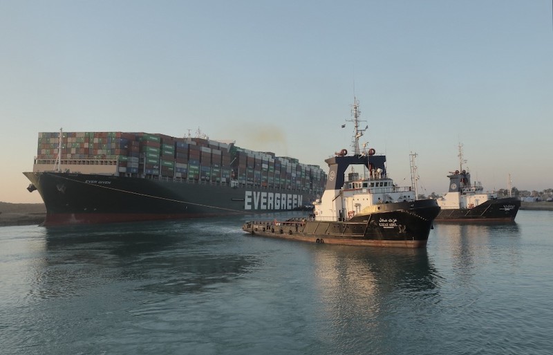 Ships go through Suez Canal after giant container vessel freed