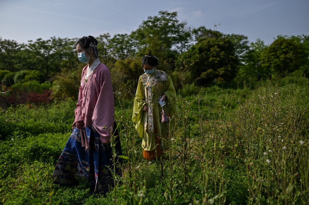 Flickers of joy in Wuhan mask deep fears