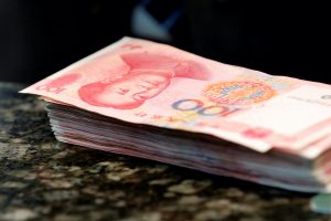 China’s Yuan Eases from Six-Month Dollar Peak