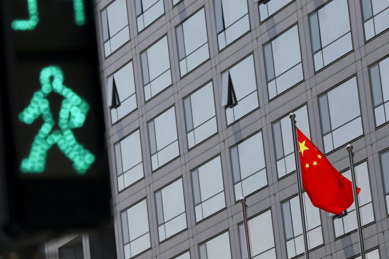 A Chinese flag is seen outside the China Securities Regulatory Commission (CSRC) building in Beijing