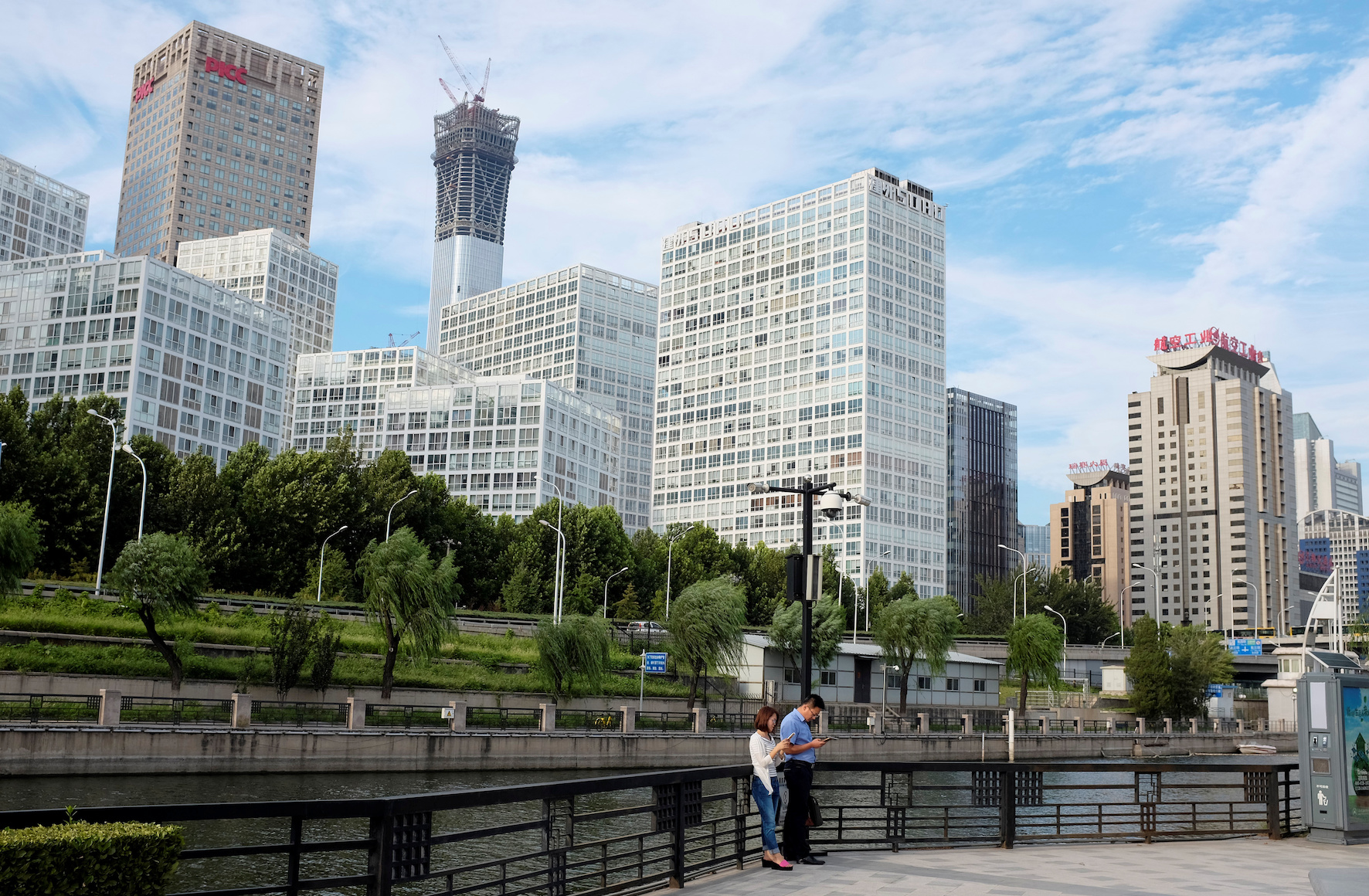 People rest at a park near Beijing's central business area