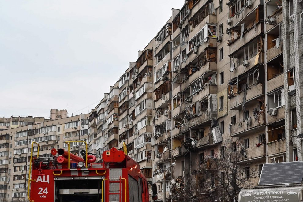 Russia Ukraine war: Firefighters work at a damaged residential building at Koshytsa Street, a suburb of the Ukrainian capital Kyiv, where a military shell allegedly hit, on February 25, 2022. - Invading Russian forces pressed deep into Ukraine as deadly battles killed dozens and forced hundreds to flee for their lives. AFP Photo