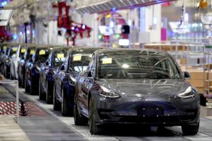 Tesla Ex-Workers Sue Electric Car Maker to Reclaim Benefits