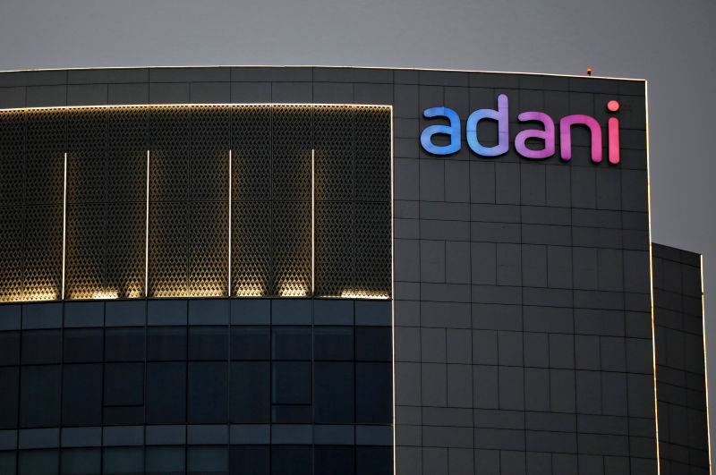 The logo of the Adani Group is seen on the facade of one of its buildings on the outskirts of Ahmedabad
