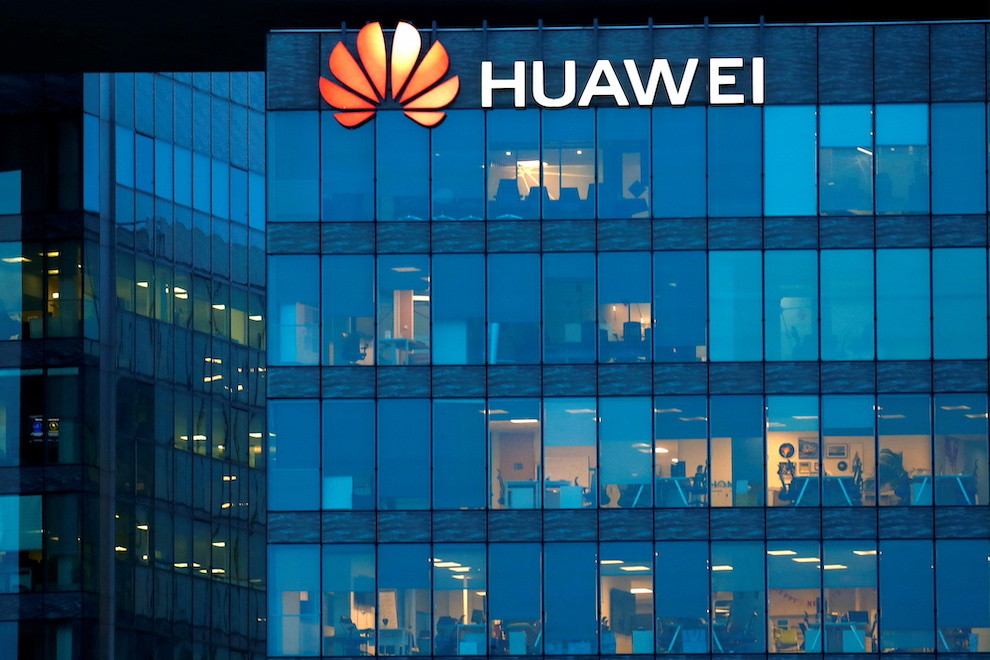 The Huawei logo is seen at its France head office near Paris