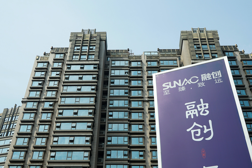 A banner for indebted China Sunac is seen in Shanghai. The developer may be near default on an offshore bond.