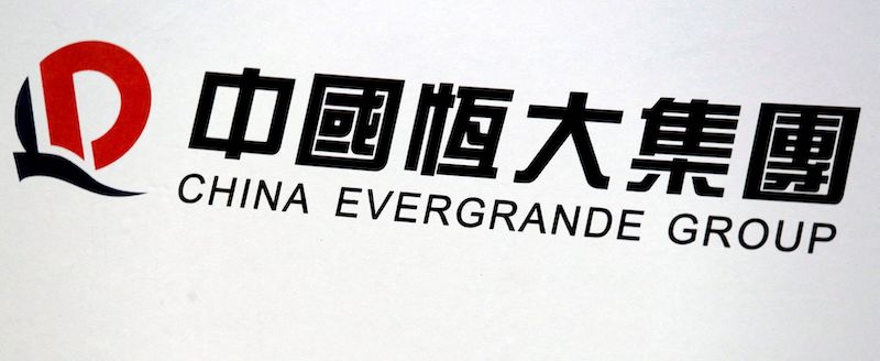 A logo of China Evergrande Group is displayed at a news conference on the property developer's annual results in Hong Kong