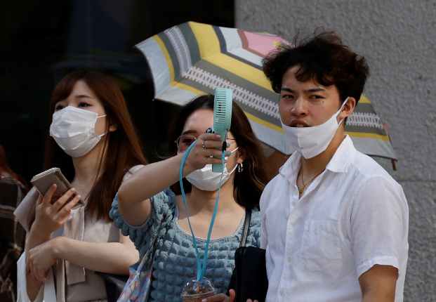 Scorching temperatures baked Japan for a fourth day as capital Tokyo's heat in June scaled 150-year-old records and unusually high demand for power put a severe strain on supply.
