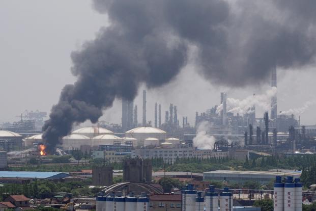 Smoke billows from a Sinopec Shanghai Petrochemical Co Ltd plant