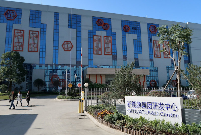 A worker stands outside a factory of Contemporary Amperex Technology Ltd (CATL) in Ningde