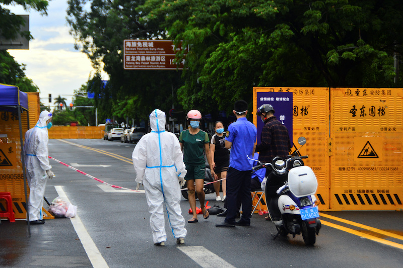 Officials man a Covid barrier near a housing enclave in Sanya during the Covid lockdown.