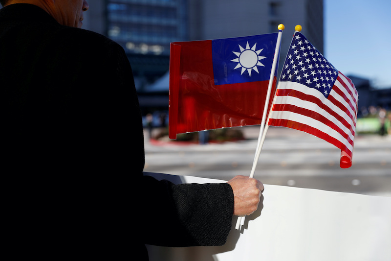 A demonstrator holds flags of Taiwan and the United States in support of Taiwanese President Tsai Ing-wen during an stop-over visit to California. Photo: Reuters