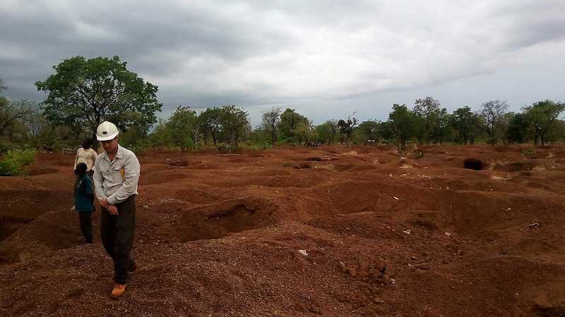 Mining companies from China and Australia are involved in a dispute over gold from adjacent mines in northern Ghana, where dozens of local men are alleged to have died.