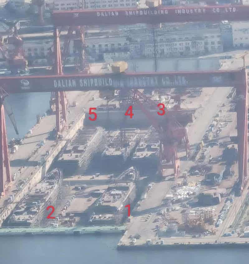 A photo posted on Weibo shows five warship at a shipyard in Dalian.