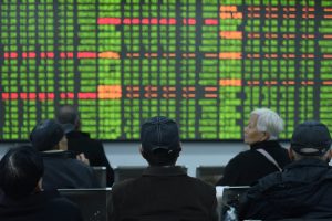 Asia Shares Mixed as Fed Dashes and Boosts Hopes on Rate Rises