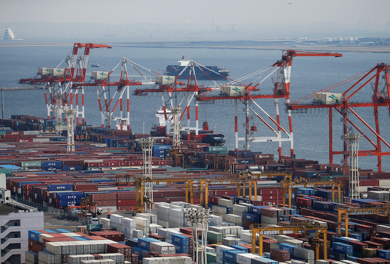 Shipping containers are seen at a port in Tokyo. Japan chaired the talks which led to Britain becoming the 12th country to join the trans-Pacific trade deal.