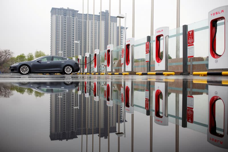 A Tesla car at a charging point in Beijing