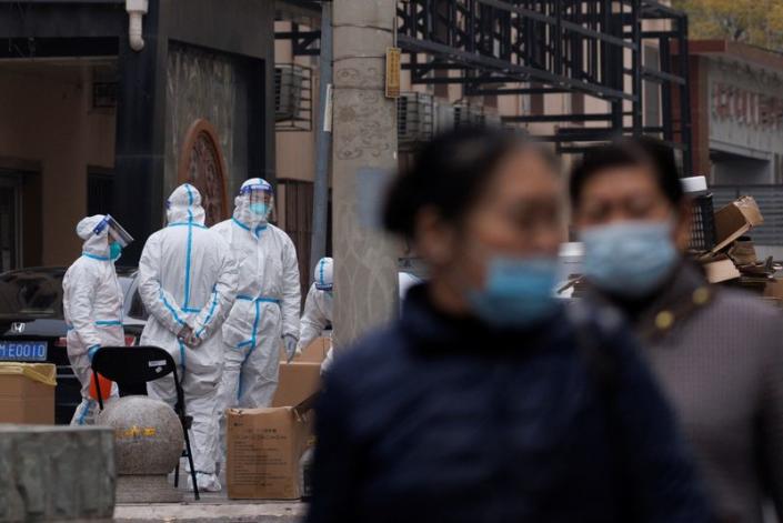 Beijing and Guangzhou locked down areas on Monday in a bid to slow the spread of Covid infections.