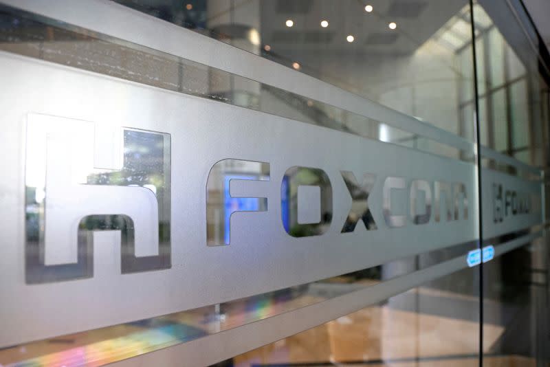 The Foxconn logo is seen on a glass door at its office building in Taipei