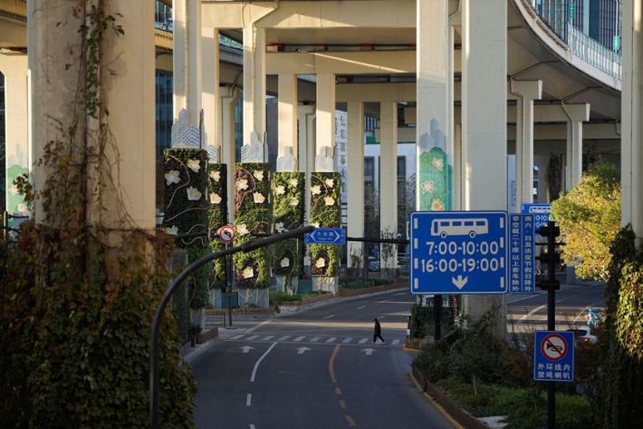 A man crosses an empty road, as Covid-19 outbreaks continue in Shanghai, China