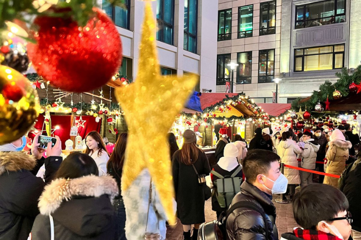 People visit a Christmas market, as Covid-19 outbreaks continue in Shanghai, China