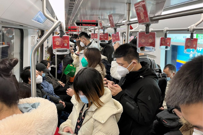 Commuters ride a subway train during the morning rush hour amid the Covid-19 outbreak, in Shanghai, China