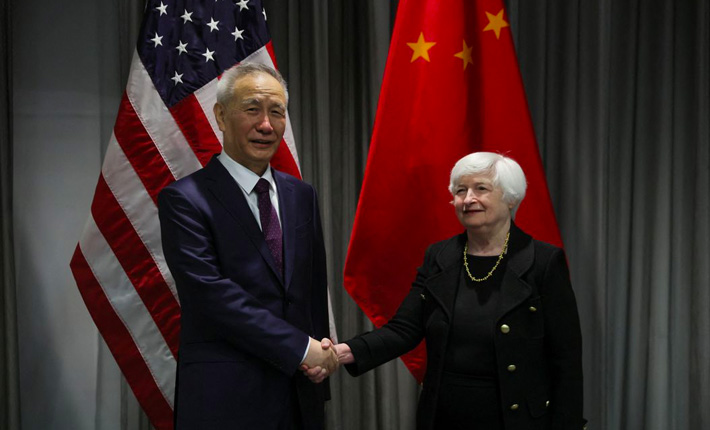US Treasury Secretary Janet Yellen shakes hands with Chinese Vice Premier Liu He as they meet for talks in Zurich, Switzerland