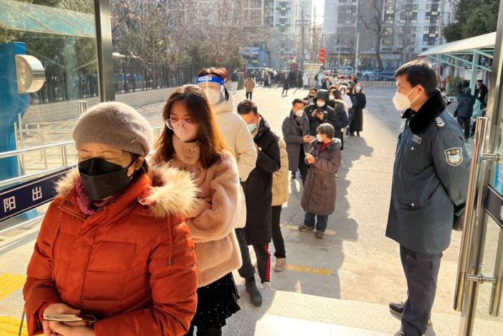 Chinese Queue For New Passports as Borders Reopen
