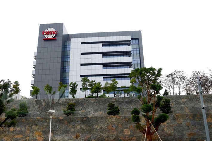 A person walks pass a TSMC building in Tainan, Taiwan