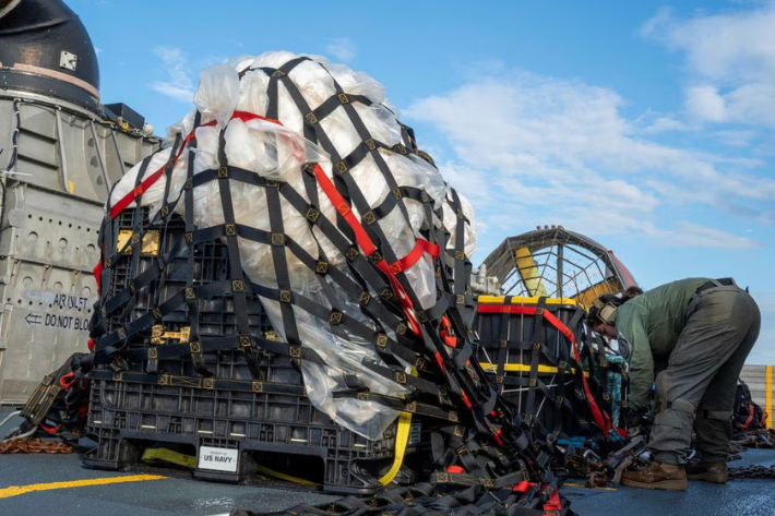 US Navy sailors assigned to Assault Craft Unit 4 prepare material recovered in the Atlantic Ocean from a high-altitude Chinese balloon