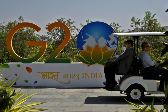 Delegates ride in a buggy at G20 finance officials meeting venue near Bengaluru, India