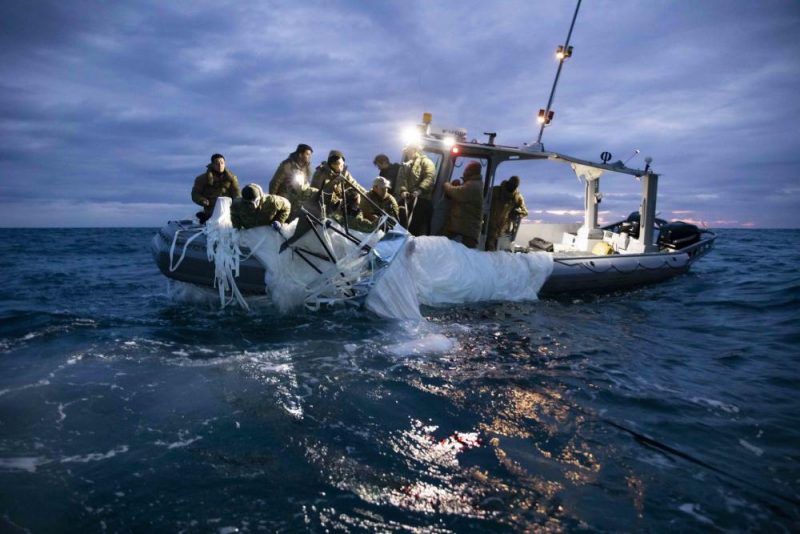 US Navy personnel pull remains of the Chinese spy balloon on board a vessel off Myrtle Beach, South Carolina on Feb 5, 2023. Image: DVIDS, Tyler Thompson.