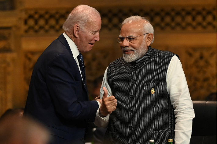 President of the U.S. Joe Biden speaks with Prime Minister of India Narendra Modi at the G20 Summit opening session in Nusa Dua, Bali, Indonesia