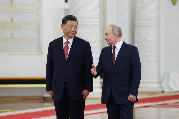 Russian President Vladimir Putin and Chinese President Xi Jinping attend a welcome ceremony before Russia - China talks in narrow format at the Kremlin in Moscow, Russia
