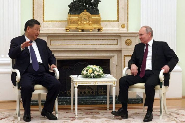 Russian President Vladimir Putin and Chinese President Xi Jinping attend a meeting at the Kremlin in Moscow, Russia
