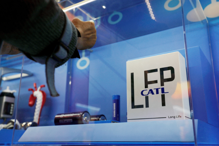 The logo of Chinese battery maker CATL is seen among a display of batteries at an exhibition in Beijing, China