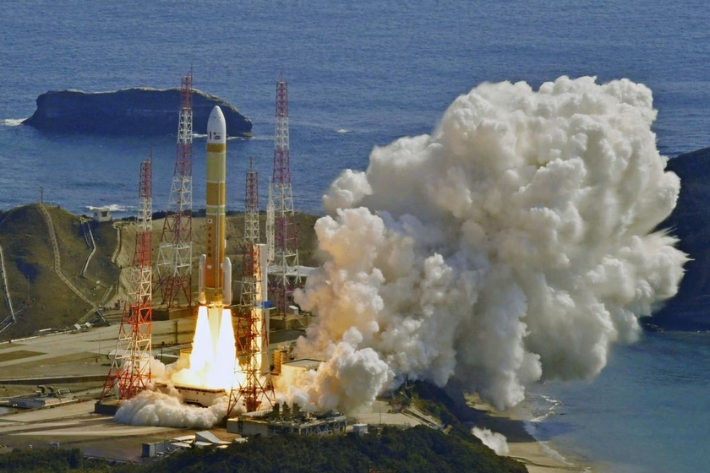 An aerial view shows an H3 rocket carrying a land observation satellite lift off from the launching pad at Tanegashima Space Center on the southwestern island of Tanegashima, Kagoshima Prefecture, southwestern Japan