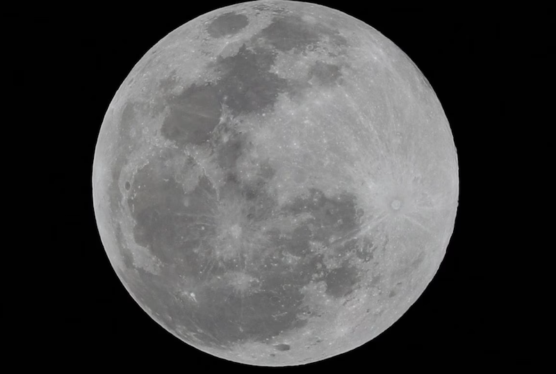 A full moon is seen over Mexico City, Mexico, April 5, 2023. REUTERS/Henry Romero/File Photo