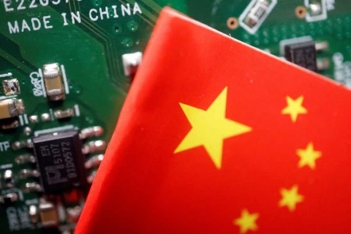 China's flag is seen with a computer chip