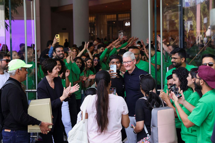 Apple CEO Tim Cook and Deirdre O'Brien, Apple's senior vice president of Retail and People greet people at the inauguration of India's first Apple retail store in Mumbai