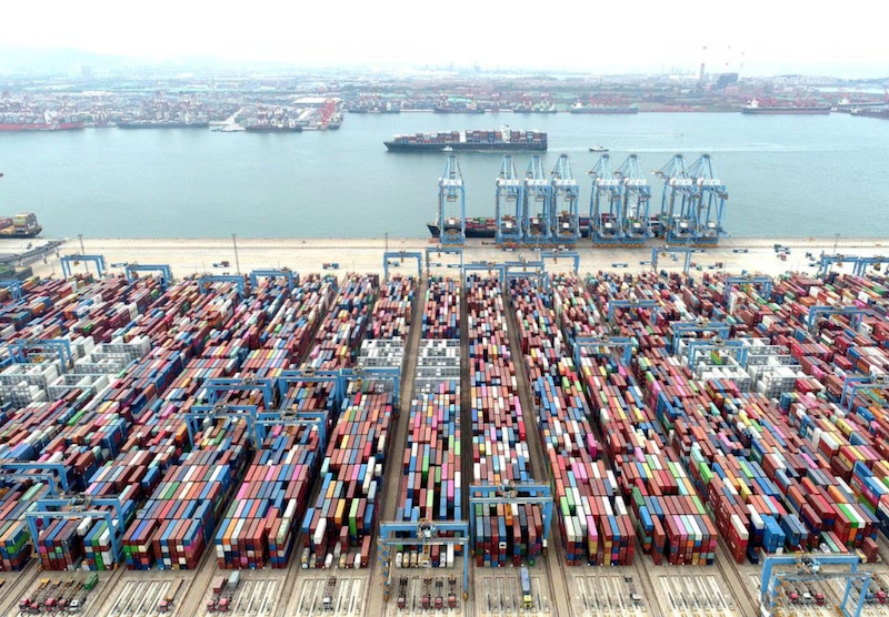 An aerial view shows containers and cargo vessels at the Qingdao port in Shandong province, China May 9, 2022. China Daily via REUTERS/File Photo