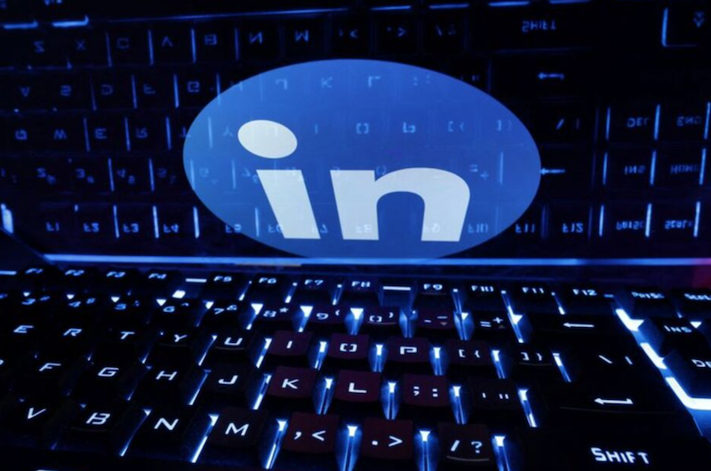 A keyboard is placed in front of a displayed LinkedIn logo in this illustration taken February 21, 2023. REUTERS/Dado Ruvic/IllustrationREUTERS